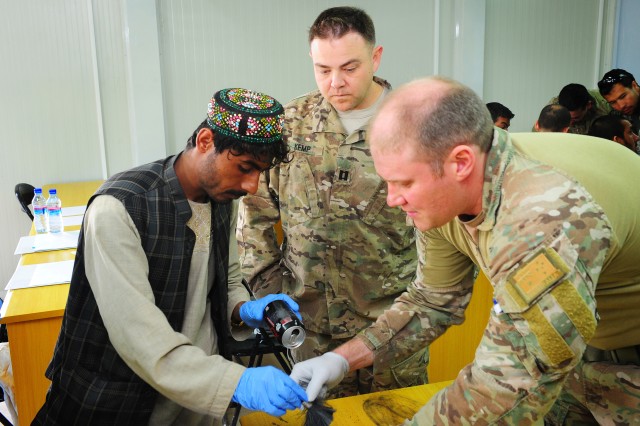 Afghan investigators take lead