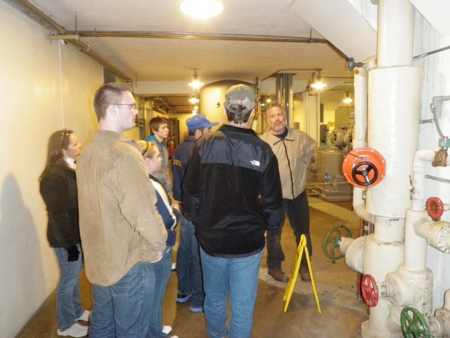 Ben Bremer gives a group of Mountain Home High School students a tour of the Norfork Dam hydropower plant as part of the school's annual mentorship field day