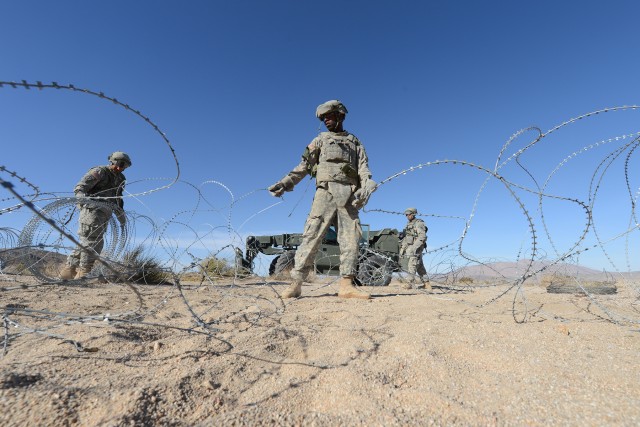 299th BSB sets up concertina wire at NTC