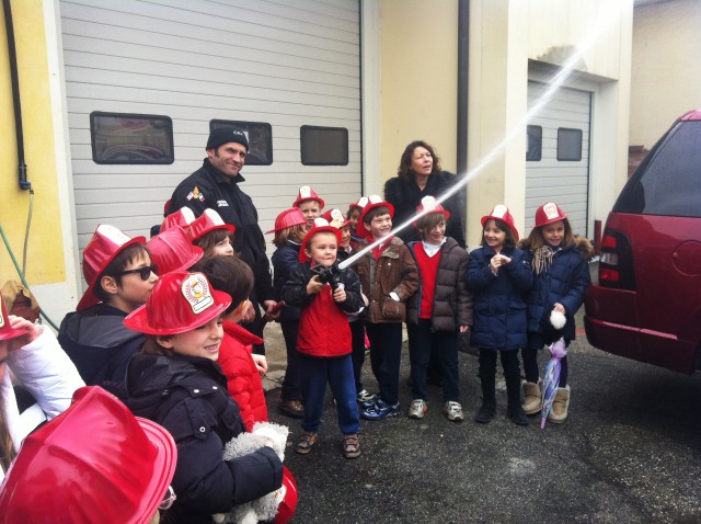 Little English School children man fire hose