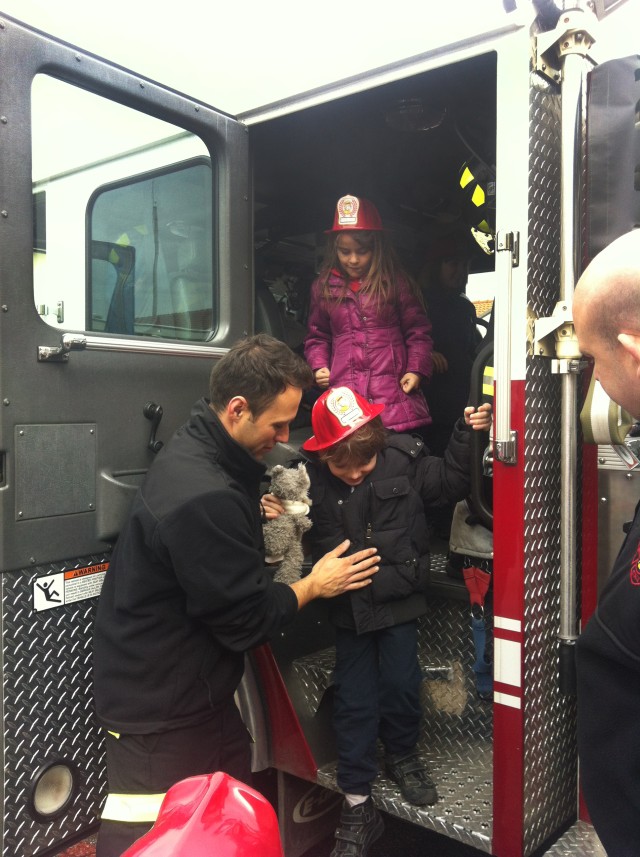 Little English School children explore fire truck