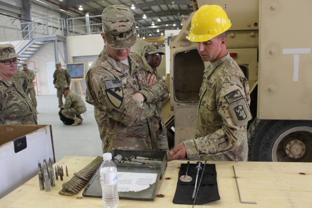 Cpl. Strohl briefs SMA on ammunition abatement process