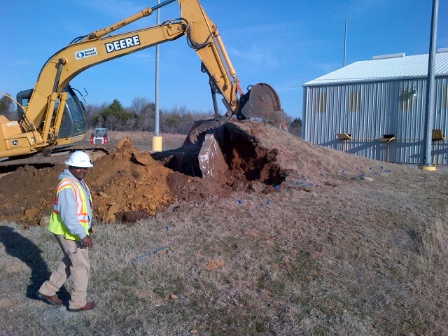 Excavators removing safety structures