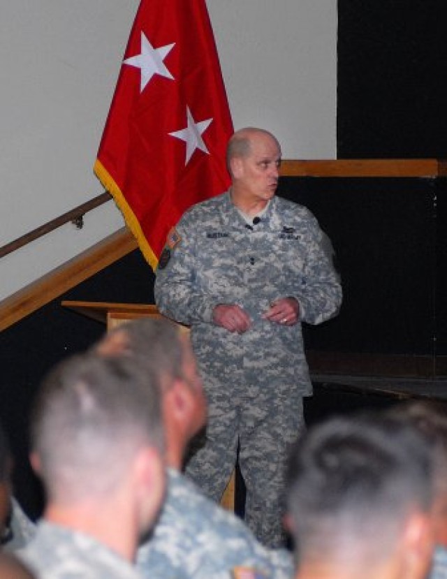 Maj. Gen. Richard Mustion, Army Human Resources Command commanding general, briefs Soldiers at Fort Irwin on updates to evaluation reports and ways of retaining quality personnel within the Army, Marc