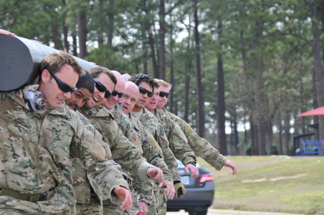 Airmen shoulder load in remembrance of fallen comrade