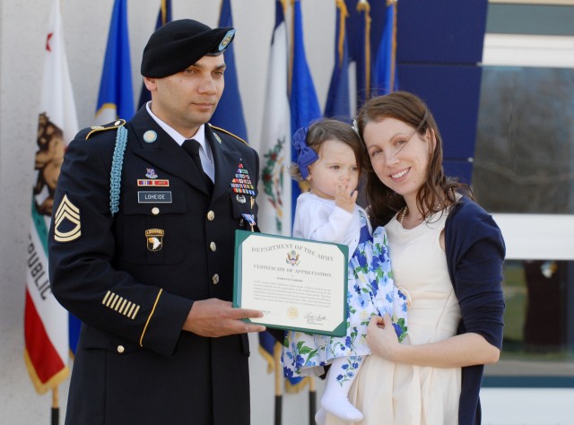 Sgt. 1st Class Matthew Loheide with wife and daughter