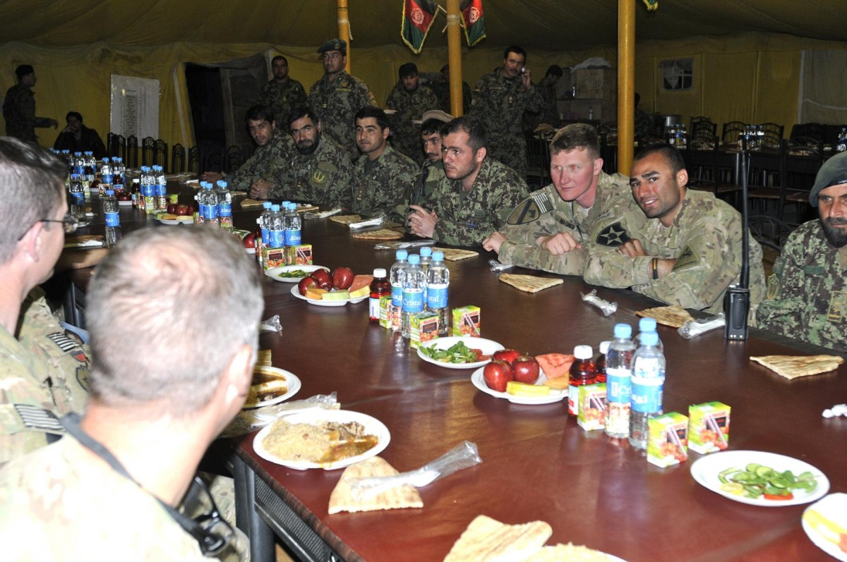 Afghan and US soldiers celebrate successful mission together during ...