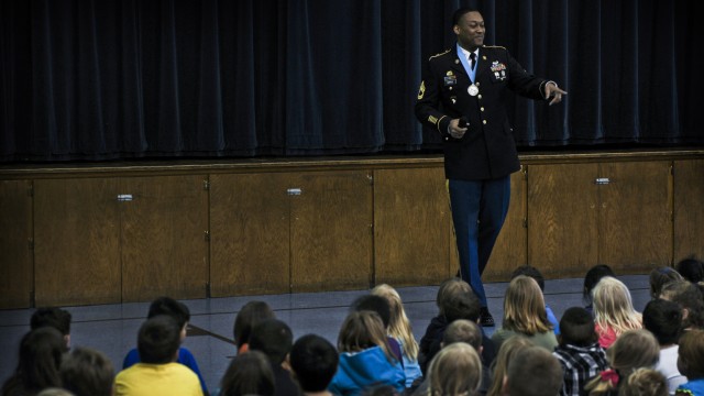 RIA Sgt. Audie Murphy Association members speak to Moline students