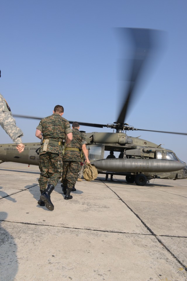 U.S., Guatemalan officials board UH-60 Blackhawk