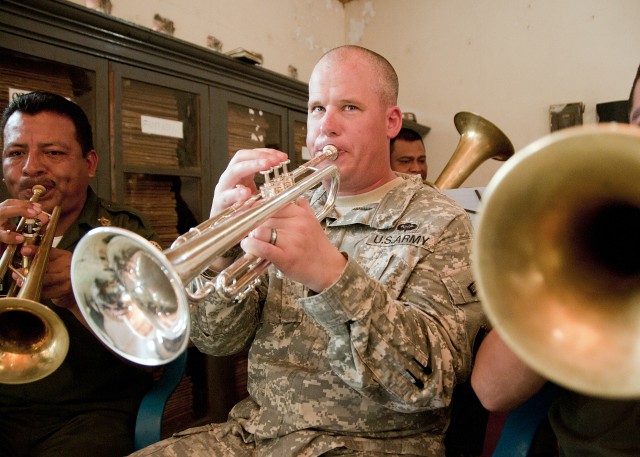 Army band commander performs with El Salvador band