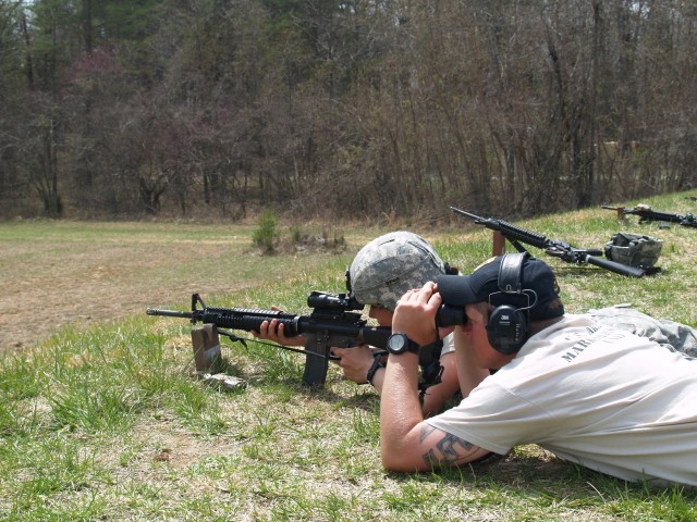 USAMU instructor coaches 19th Engineer Battalion Soldier during Squad Designated Marksmanship training