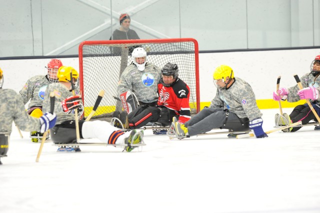 Wounded Warriors playing sled hockey.