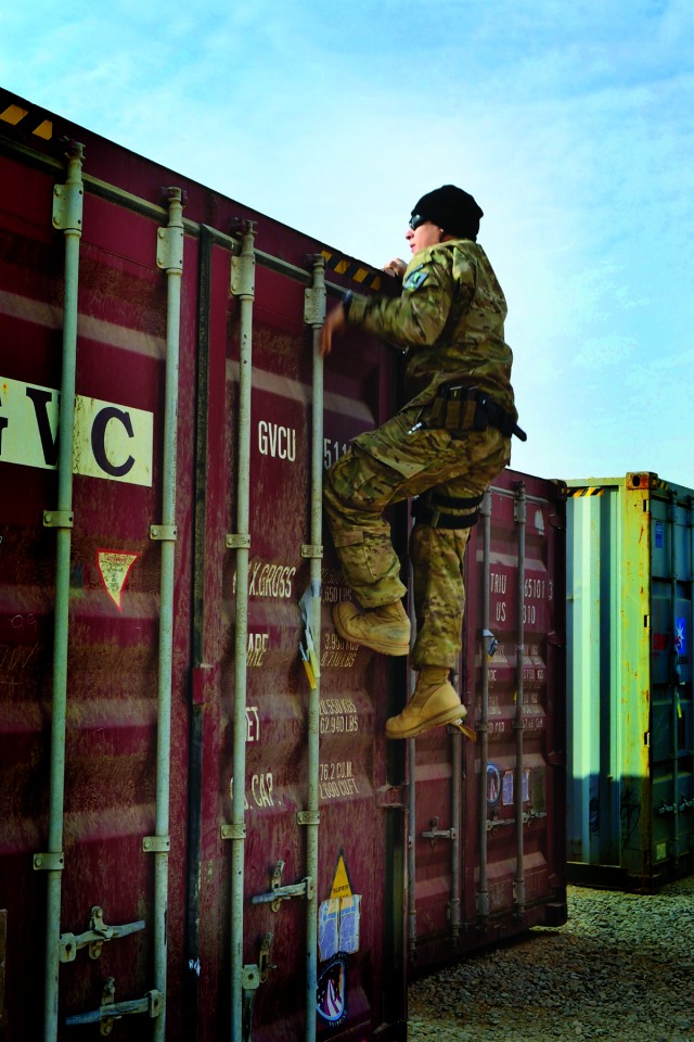 Coast Guard Petty Officer checks container for seaworthiness