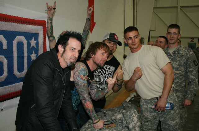 Drowning Pool sign autographs and get photos with their fans