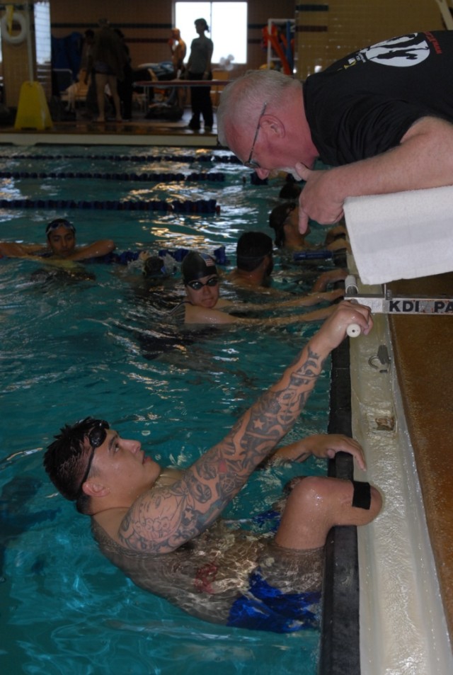 Spc. Quinton Picone Talks to His Swimming Coach