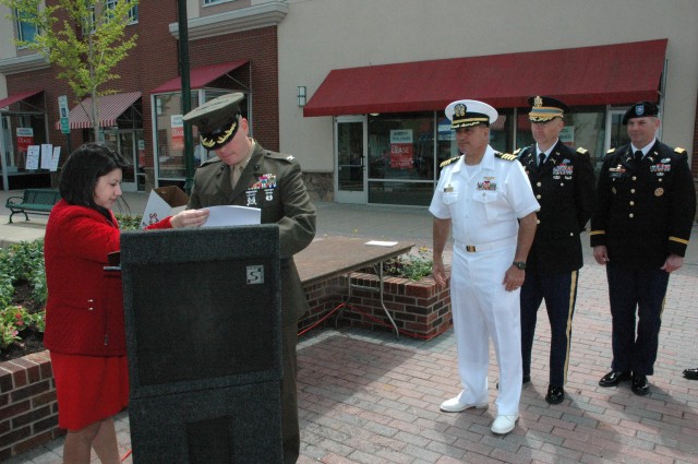 Officers representing area military bases and the National Guard take turns signing a community covenant with the City of Fredericksburg and surrounding counties