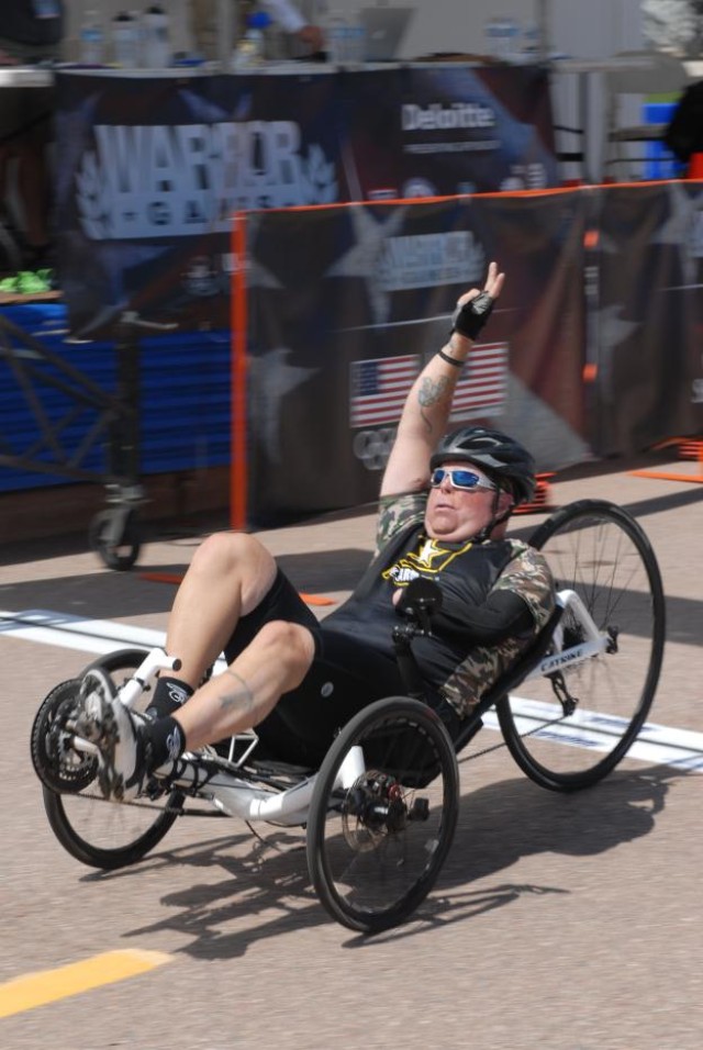 Army Staff Sgt. Michael Lage crosses the finish line