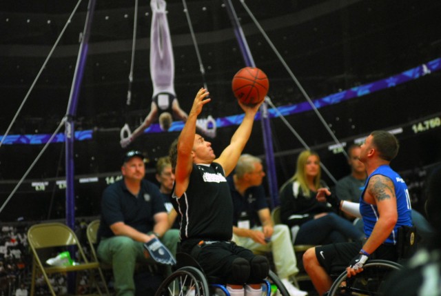 Army veteran Jimmy Green catches the ball during Warrior Games wheelchair basketball competition