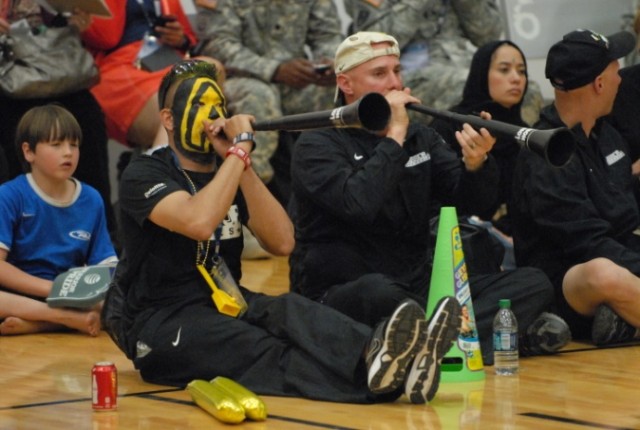 Fans cheer on Team Army at Warrior Games sitting volleyball match