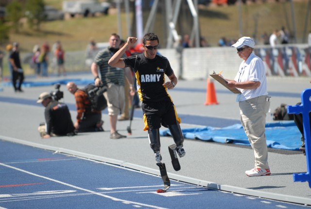 Army torch bearer, retired Spc. Luis Puertas claims gold at Warrior Games