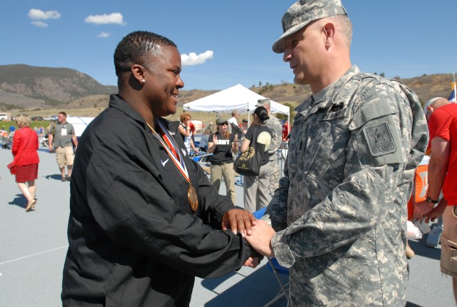 Sgt. Maj. of the Army presents Sgt. Monica Southall with Warrior Games track and field gold medal
