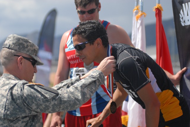 Sgt. Maj. of the Army awards track and field gold medal to Army Veteran Luis Puertas at the 2013 Warrior Games