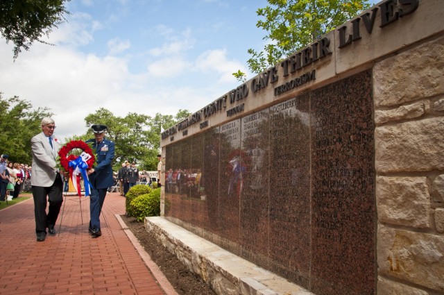 Wreath placed at wall of heroes during Memorial Day ceremony