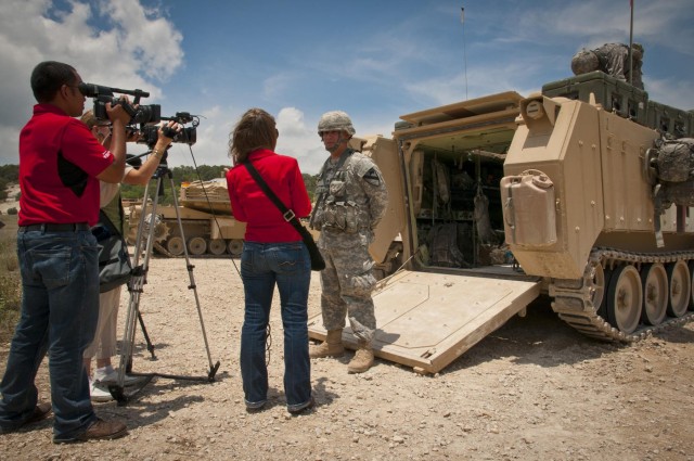 Television reporters interview soldiers before SMA visit on Fort Hood