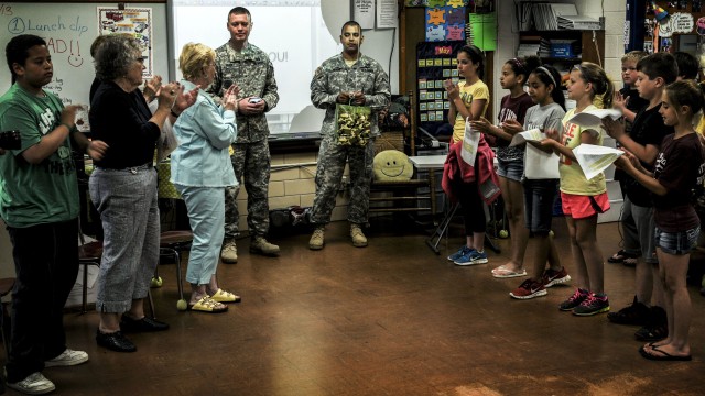 Arsenal Sgt. Audie Murphy Association receive 'kissing pillows' from elementary school