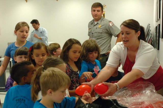 Corps personnel help junior gardeners grow