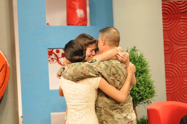 Soldier surprises daughters on live TV