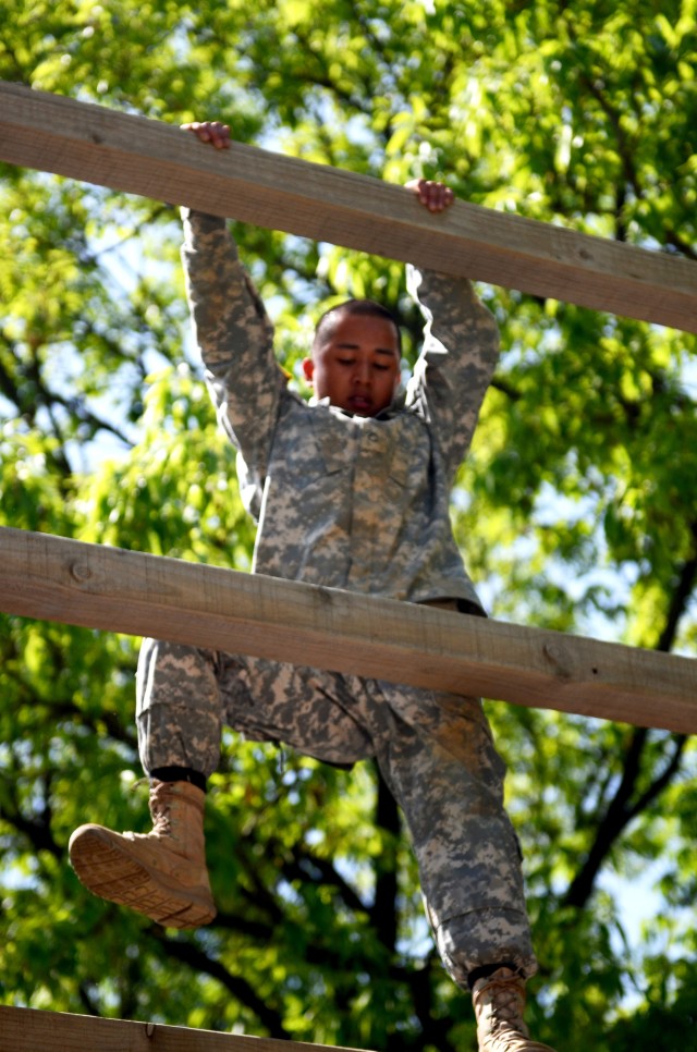 Pfc. Edward Mique, a San Jose native and combat engineer for Company C, 1st Brigade Support Battalion, 1st Armored Brigade Combat Team, 2nd Infantry Division, climbs down Jacobs ladder during the Spar