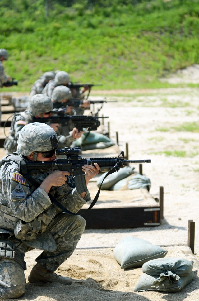 Soldiers participating in the Spartans Shield Ride fire in the kneeling position while qualifying at the M16 range during the competition which ran from May 22 to 23, 2013