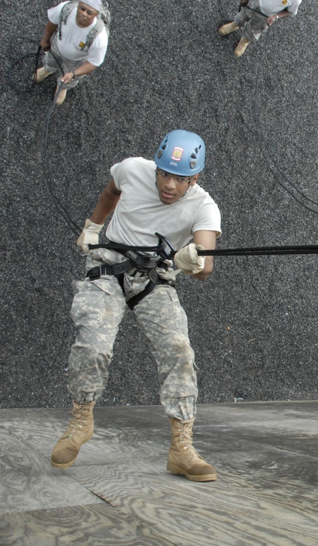 JROTC Cadet Eric Young, 4th Platoon, B Company, makes his third rappel of the morning.