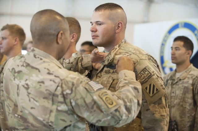 195 'Dog Face' soldiers awarded combat badges
