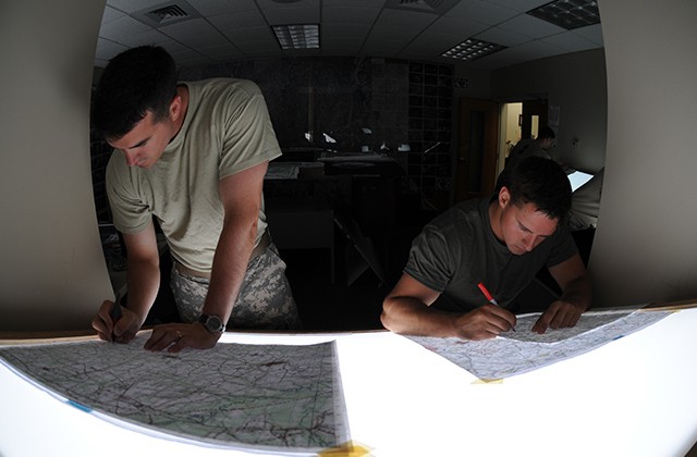 Students drill down during flight school to construct maps