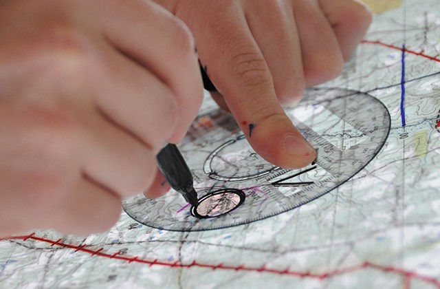 Students drill down during flight school to construct maps
