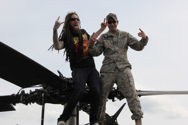 Heavy Metal Rock Pose on top of a UH-60 Blackhawk helicopter.