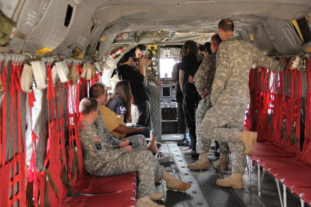 Korn gets a peek into the cockpit of a CH-47 Chinook helicopter.