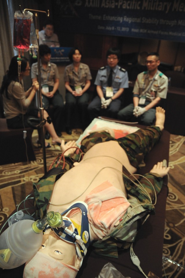 South Korean military medical personnel discuss the treatment decisions