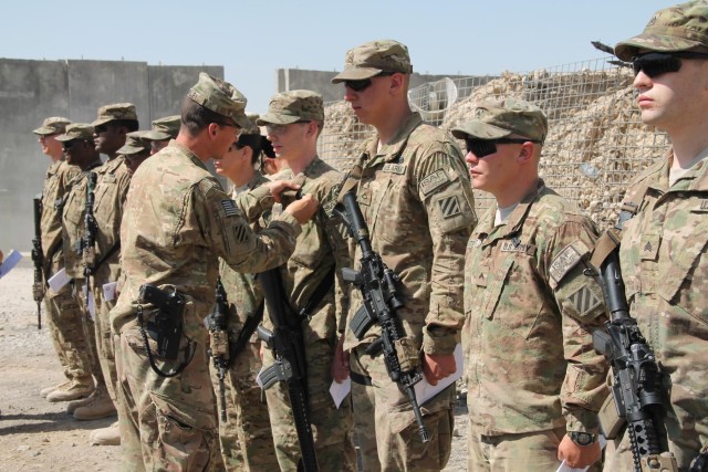'Mustang' soldiers awarded combat badges