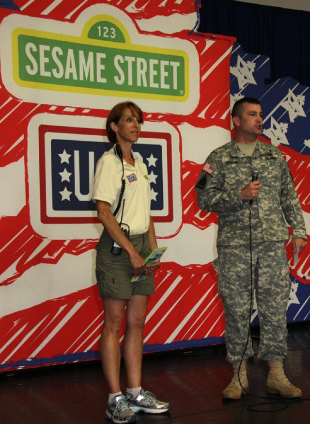 Col. Benson greets the audience and introduces the performance.