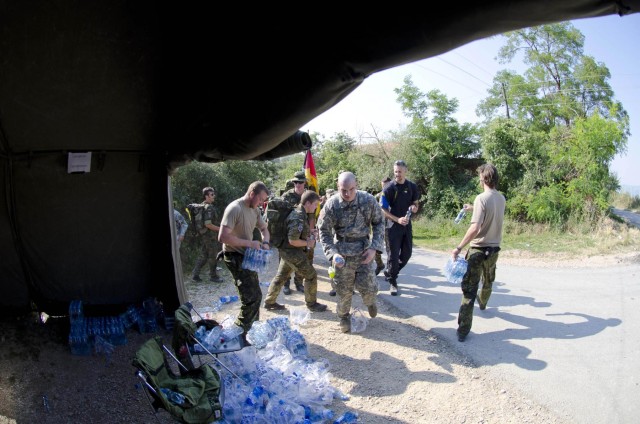 KFOR soldiers face summer heat during DANCON march