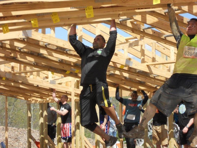 Maj. Joshua Darling navigates a Tough Mudder Obstacle