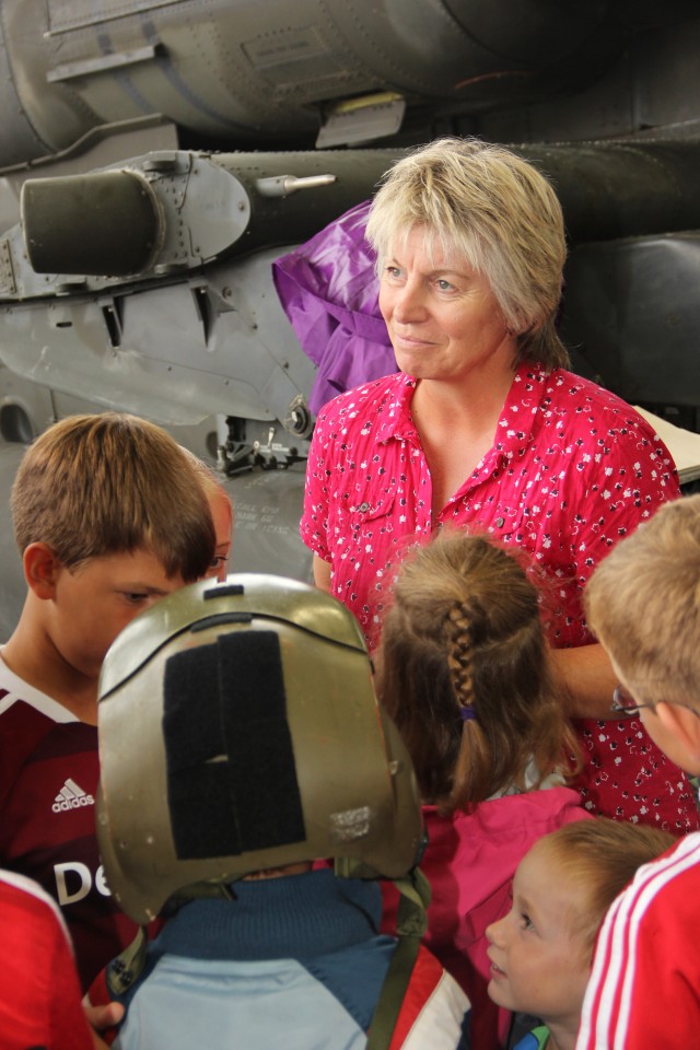 The 12th Combat Aviation Brigade Community Liaison Specialist answers questions.