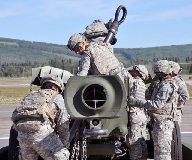 2-8 FA Soldiers slingload a howitzer
