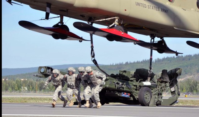 2-8 FA Soldiers slingload a howitzer