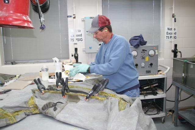 Inspecting a chemical suit