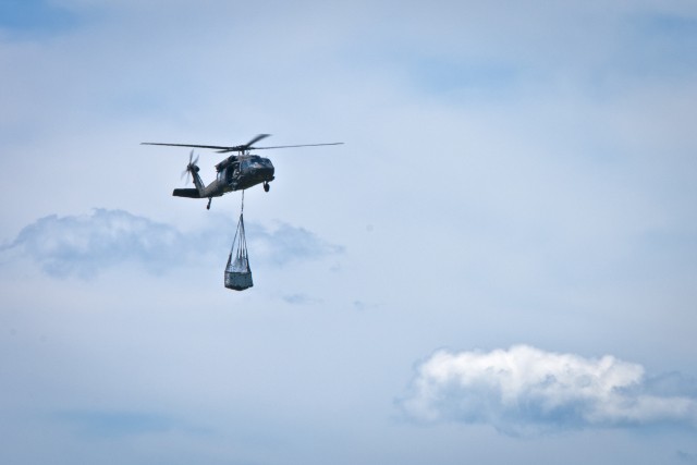 UH-60 Black Hawk flies supplies through the sky