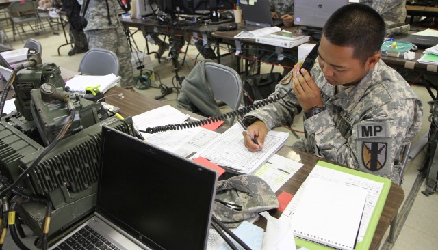 Soldiers with the Signals Operations section of Headquarters and Headquarter Company, 303rd Maneuver Enhancement Brigade, 9th Mission Support Command assemble a very small aperture terminal (VSAT) to